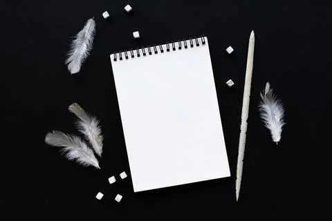 White notebook mockup template on black background with magical mysterious mood. Фото