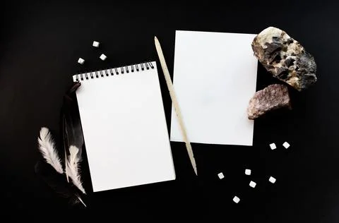 White notebook mockup template on black background with magical mysterious mood. Фото