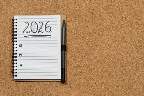 A white notebook with a pen at the left side of the screen with 2026 year goa Foto stock