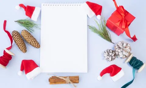 White notepad and attributes of christmas or new year on blue background Stock Photos