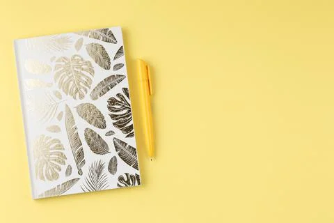 White notepad with a pen. Stock Photos