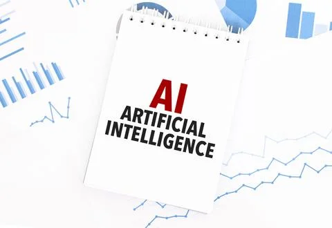 White notepad with text AI - Artificial Intelligence on the financial docum.. Foto stock