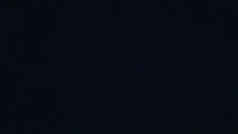 White nowflakes floating in the air on a black background.Ideal for making video Stock Footage 102372800
