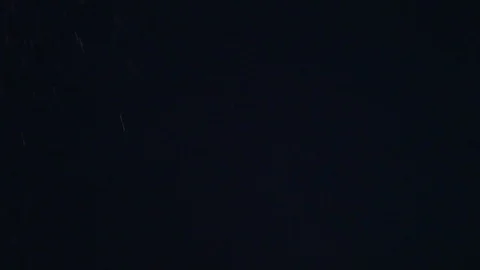White nowflakes floating in the air on a black background.Ideal for making video Stock Footage 102381601