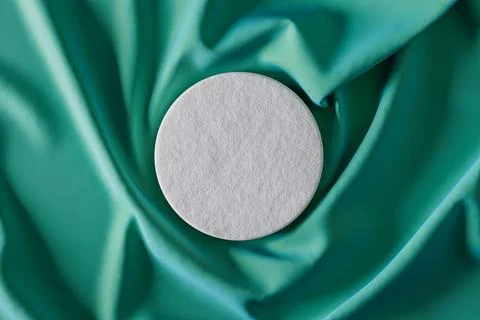 White object is placed on a green fabric Stock Illustration