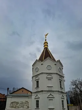 White octagonal bell tower of Holy Trinity Convent in Zadonsk with a golden.. Stock Photos