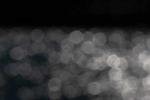 White octagonal bokeh lights reflecting in lake water reflections graphic resour Stock Photos