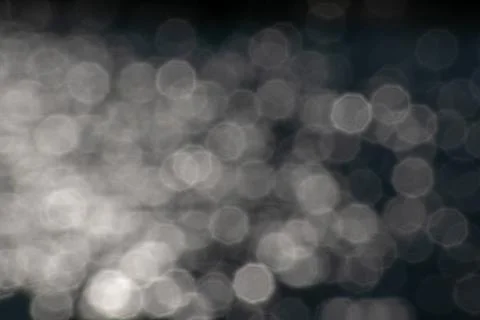 White octagonal bokeh lights reflecting in lake water reflections graphic resour Stock Photos