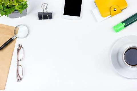 White Office desk table with computer, pen and a cup of coffee, lot of thin.. Stock Photos
