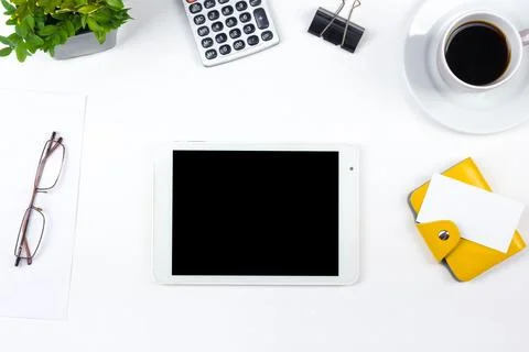 White Office desk table with computer, pen and a cup of coffee, lot of thin.. Stock Photos