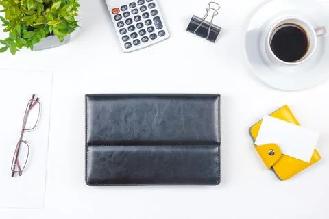 White Office desk table with computer, pen and a cup of coffee, lot of thin.. Stock Photos