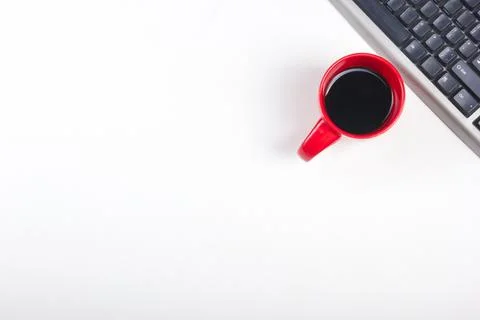 White Office desk table with computer, pen and a cup of coffee, lot of things Stock Photos