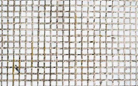 White old tweathered tile background texture captured with a sunlight. Stock Photos
