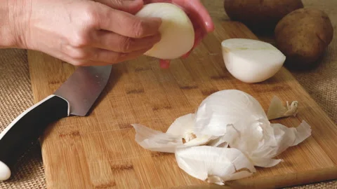 White onion close-up. Peeling and chopping onion Stock Footage 224027111