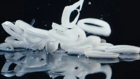 White onion rings fly down Stock Footage 117398909