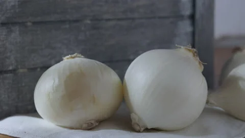 White onions on table Stock Footage 234439108