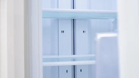 White open refrigerator close-up with empty shelves, front view. Stock Footage 312183208