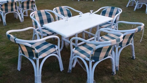 White Outdoor Patio Dining Set Six Plaid Cushioned Armchairs &amp; Rectangular Table Stock Footage 343574361