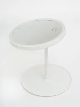 White oval led mirror on stand angled view Stock Photos
