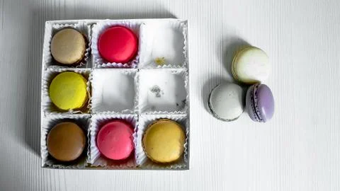 White pack with Macarons cookie, on a white wooden background. View from above Fotos Stock