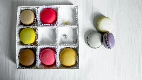 White pack with Macarons cookie, on a white wooden background. View from above Stock Photos