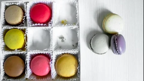 White pack with Macarons cookie, on a white wooden background. View from above Fotos Stock