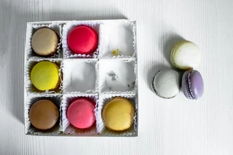 White pack with Macarons cookie, on a white wooden background. View from above Fotos Stock