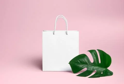 White package on a pink background. Stock Photos