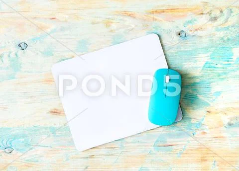 White pad with blue mouse Stock Photos