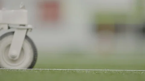 White paint being sprayed on lines in football field Stock Footage 104769231