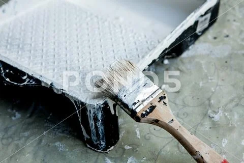 White paint, brush and tray, for painting white ceiling or trim Stock Photos