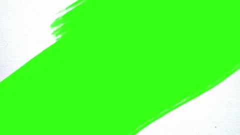 White paint brush transition spreading from center green chroma key background Stock Footage 324802243
