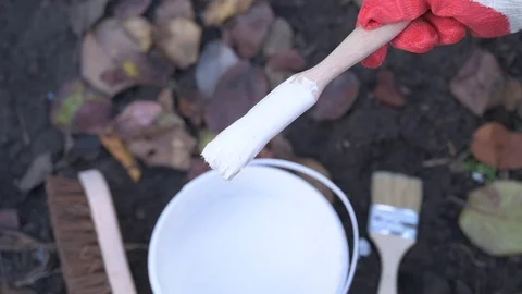 White paint drips from the brush Stock Footage 122446814