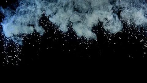 White paint drops from above mixing in water. Ink swirling underwater in slowmo Stock Footage 76375394