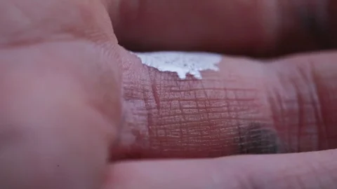 White Paint on Fingers Macro Stock Footage 126909431