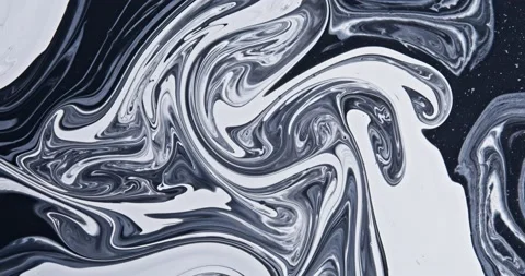 White paint flows into glitter black, abstract colors swirl and explode. Stock Footage