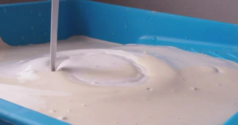 White paint pouring into a tray Video stock 305667160