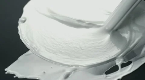 White paint splash on black surface, Slow Motion Stock Footage 12159158