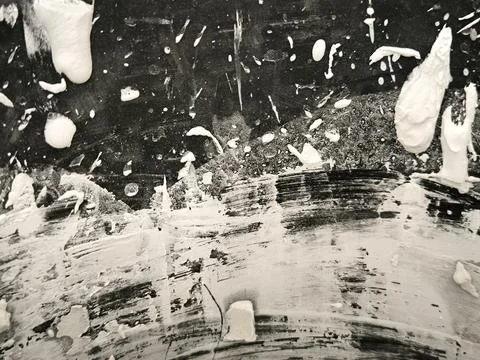 White paint splatters on dark background texture Stock Photos