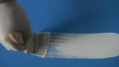 White paint stroke on blue background / canvas. Stock Footage 120617941