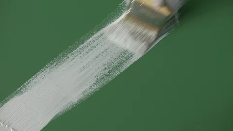 White paint stroke on green background / canvas. Video stock 120617956