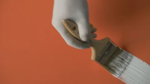 White paint stroke on orange background / canvas. Stock Footage 120617990