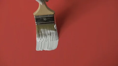 White paint stroke on red background / canvas. Stock Footage 120618001