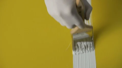White paint stroke on yellow background / canvas. Stock Footage 120618032
