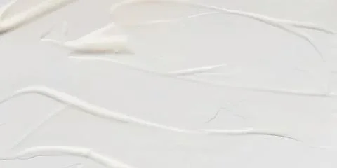 White paint strokes on a smooth textured surface Stock Photos