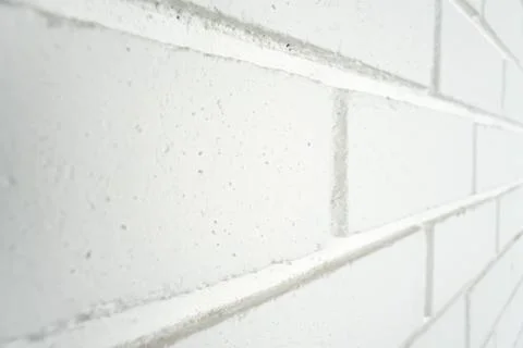 White painted brick wall at an angle. Stock Photos