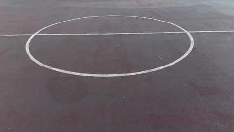 White painted center circle with horizontal line on dark asphalt  库存影片 340514992