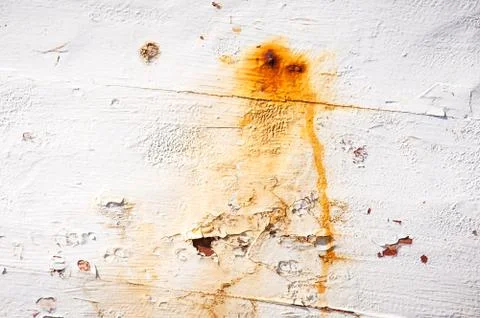 White painted old surface spotted by rust of a nail background texture Stock Photos