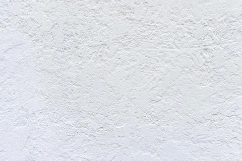 White painted plastered rough wall, white grained background Foto stock
