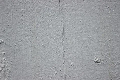 White painted wall texture with small crack detail Stock Photos